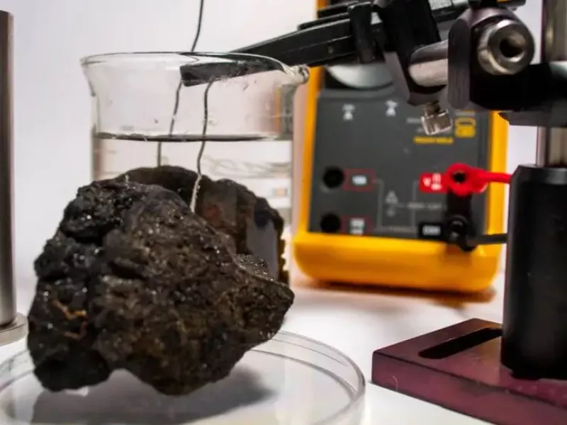 A nodule from the seabed being tested in a lab  