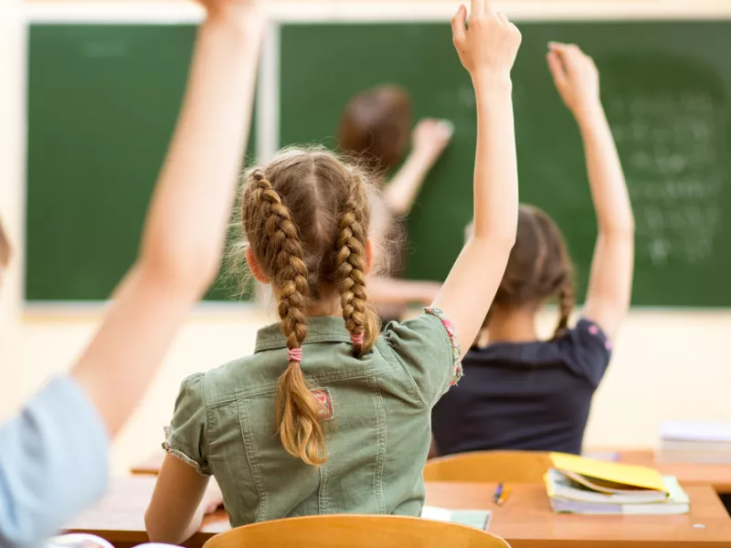 School children in classroom at lesson